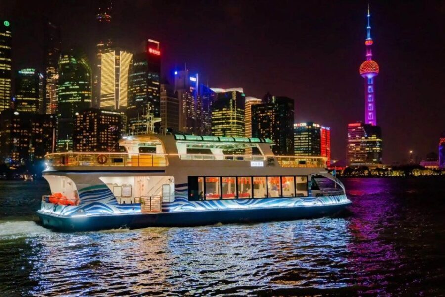 Shanghai: Night River Cruise Tour with Xinjiang Style Dining - Boarding the Huangpu: colonial Bund lights to futuristic Pudong towers
