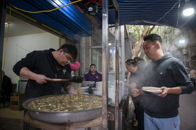 Xi'an Evening Food Tour by TukTuk - The Muslim Quarter stop: where the stories are part of the meal